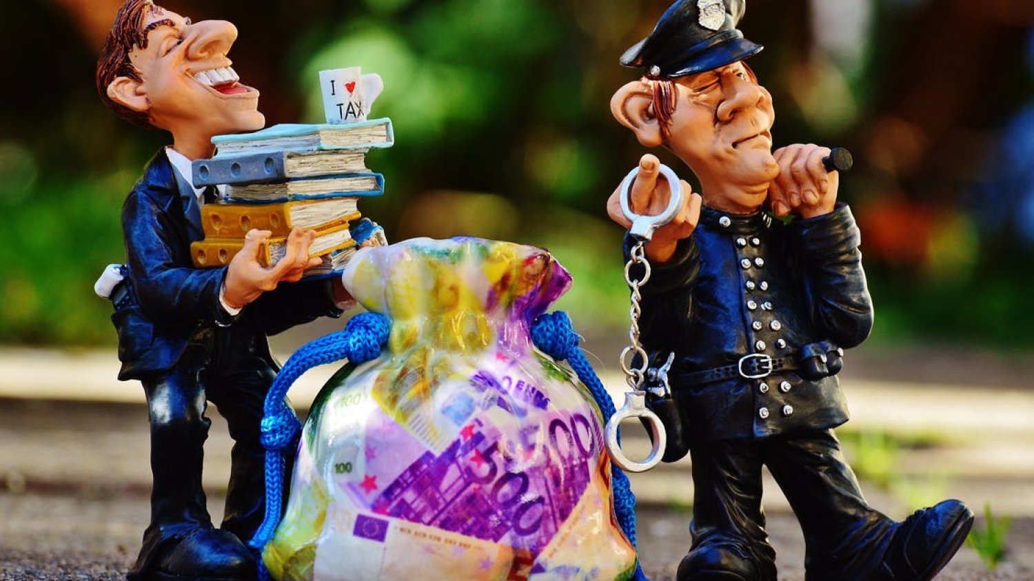 taxes-tax-evasion-police-handcuffs