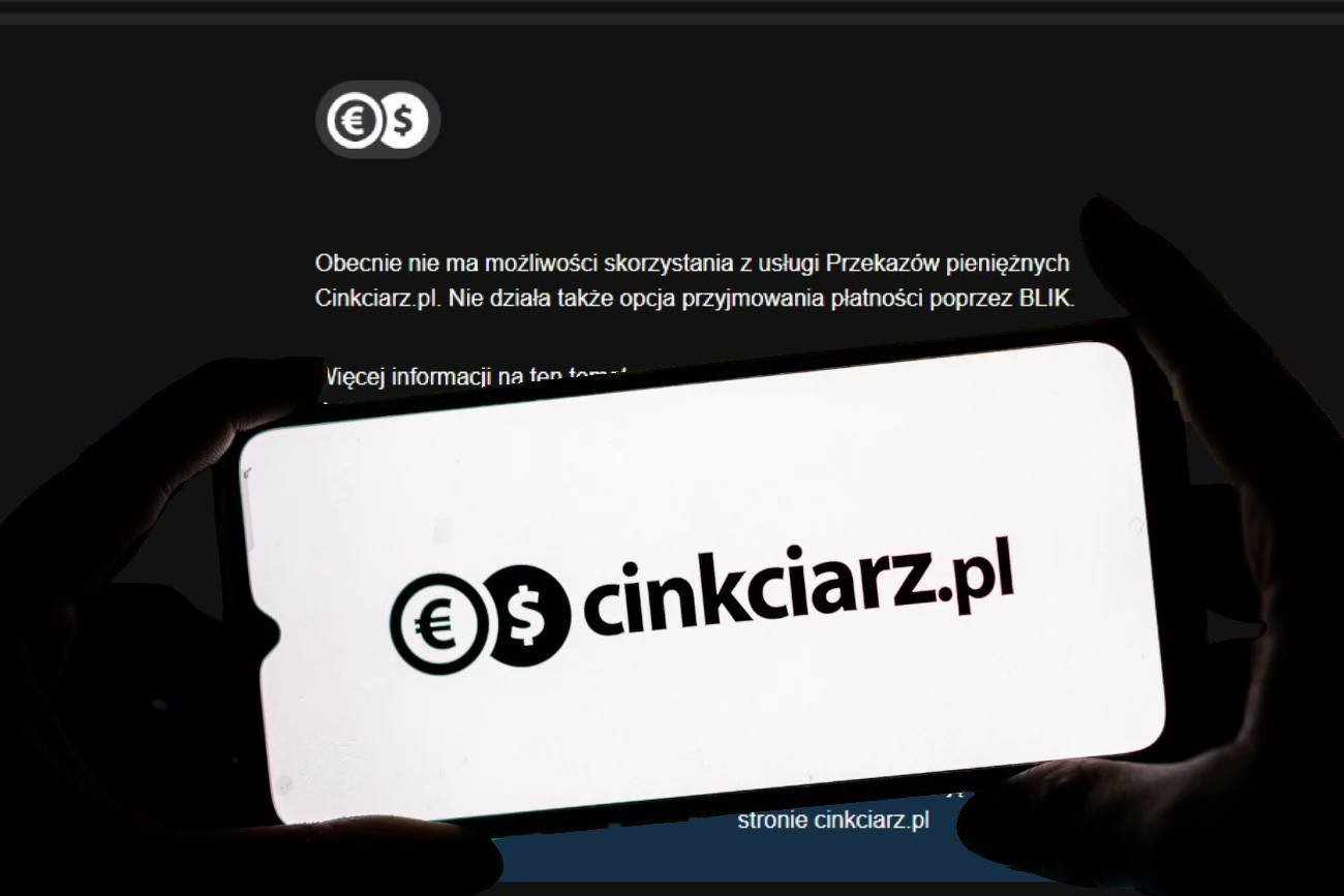 Smartfon z logo Cinkciarz.pl na tle komunikatu firmy.