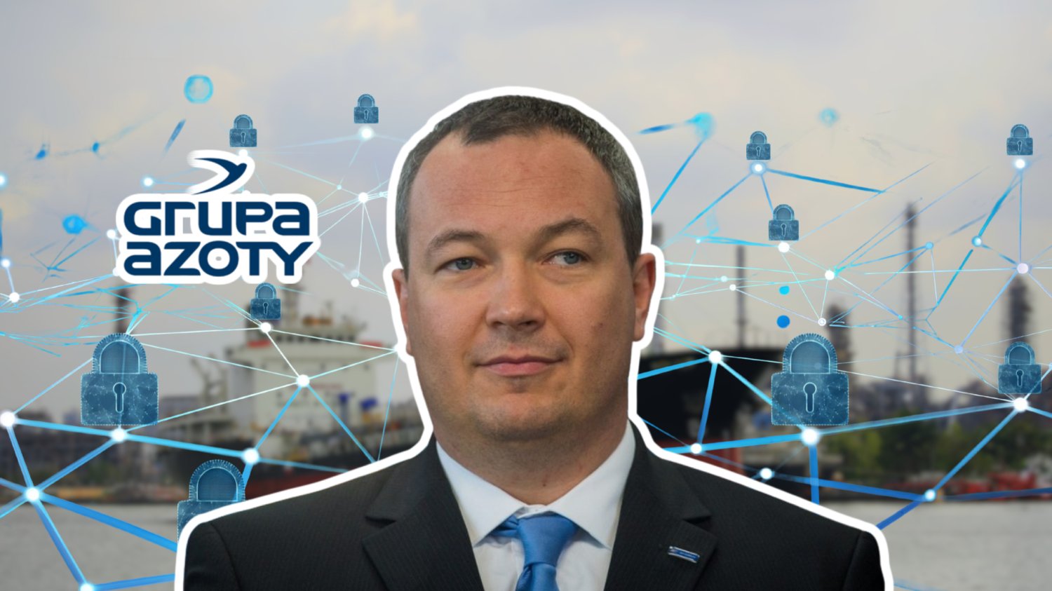 Prezes Grupy Azoty. W tle tankowiec. Logo grupy Azoty i siatka cyfrowa z kłódkami.