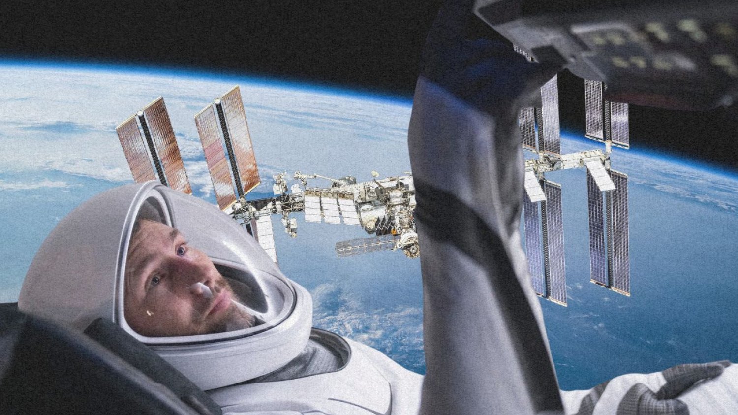 Sławosz Uznański-Wiśniewski na tle ISS.