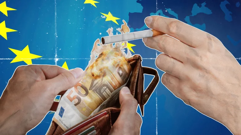Zapalanie papierosa płonącymi euro i flaga UE w tle.