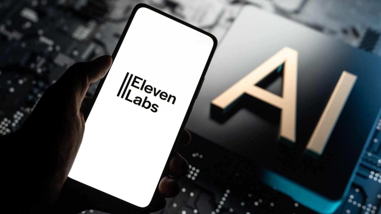Telefon z logiem ElevenLabs i grafika z napisem "AI". Firma warta 11 mld dolarów oferuje pracę marzeń. Zgłosiło się ponad 100 chętnych w 3 dni