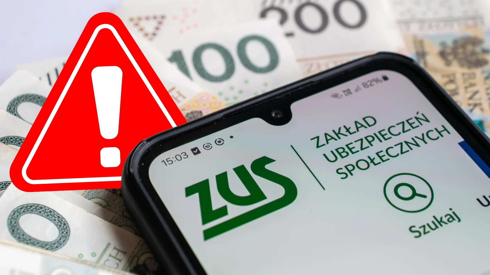 Telefon z logo ZUS na stole. Znak ostrzeżenia. Pieniądze na stole.